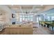 An open concept great room boasts hardwood floors, a ceiling fan, and recessed lighting at 5825 Trailwood Ct, Suwanee, GA 30024