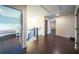 Hallway with dark hardwood floors and railing at 5825 Trailwood Ct, Suwanee, GA 30024