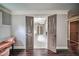 Hallway leading to a bedroom with an open door at 5825 Trailwood Ct, Suwanee, GA 30024