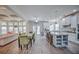 Bright, open kitchen featuring white cabinets, stainless steel appliances, and a large island with counter seating at 5825 Trailwood Ct, Suwanee, GA 30024
