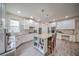 Modern kitchen with granite countertops, stainless steel appliances, and a functional island with bar stool seating at 5825 Trailwood Ct, Suwanee, GA 30024