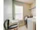 Functional laundry room area with modern washer and dryer units at 5825 Trailwood Ct, Suwanee, GA 30024
