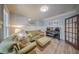 A cozy living room provides natural light, wooden floors, and comfortable seating at 5825 Trailwood Ct, Suwanee, GA 30024