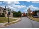 Neighborhood street view showcasing well-maintained homes and mature trees at 5825 Trailwood Ct, Suwanee, GA 30024