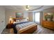 Cozy bedroom with a beautiful bed, a ceiling fan and decor providing a relaxing retreat at 5989 Zane Ct, Douglasville, GA 30135