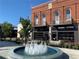 Brick building with a fountain in front on a sunny day at 5989 Zane Ct, Douglasville, GA 30135