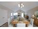 Bright dining room features a vaulted ceiling, hardwood floors and stylish decor creating a perfect space for entertaining at 5989 Zane Ct, Douglasville, GA 30135
