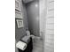 Bathroom features modern white subway tile and gray walls at 2151 Overland Way, Powder Springs, GA 30127