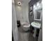 Chic bathroom with a pedestal sink, freestanding tub, and stylish fixtures at 2151 Overland Way, Powder Springs, GA 30127