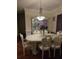 Formal dining room featuring elegant chandelier and hardwood flooring at 2151 Overland Way, Powder Springs, GA 30127