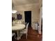 Formal dining room featuring elegant chandelier and hardwood flooring at 2151 Overland Way, Powder Springs, GA 30127