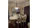 Formal dining room featuring elegant chandelier and hardwood flooring at 2151 Overland Way, Powder Springs, GA 30127