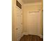 Hallway featuring classic doors and wood floors at 2151 Overland Way, Powder Springs, GA 30127