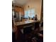 Kitchen features stainless steel refrigerator, granite countertop, and bar seating at 2151 Overland Way, Powder Springs, GA 30127