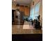 Kitchen features stainless steel appliances, granite countertops, and natural light at 2151 Overland Way, Powder Springs, GA 30127