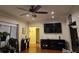 Inviting living room with hardwood floors, ceiling fan, and natural light at 2151 Overland Way, Powder Springs, GA 30127