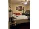 Comfortable bedroom with dark wood floors and neutral-toned decor at 2151 Overland Way, Powder Springs, GA 30127