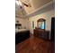 Spacious bedroom featuring dark wood floors, craftsman ceiling and an elegant dresser set at 2151 Overland Way, Powder Springs, GA 30127