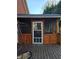 Enclosed sunroom with wood decking, natural light, and charming details at 2151 Overland Way, Powder Springs, GA 30127