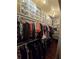 Bright walk-in closet with racks and shelves for clothing and storage at 2151 Overland Way, Powder Springs, GA 30127