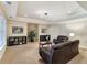 Spacious finished basement with neutral carpet, crown molding, recessed lighting and comfortable seating at 2821 Grey Moss Pass, Duluth, GA 30097