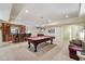 Finished basement featuring a pool table, seating, wet bar, recessed lighting, and ample space at 2821 Grey Moss Pass, Duluth, GA 30097