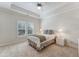 Bright bedroom with plush carpet, neutral walls, ceiling fan, and window with shutter blinds at 2821 Grey Moss Pass, Duluth, GA 30097