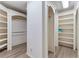 Spacious walk-in closet features custom built-in shelving and drawers for ample storage at 2821 Grey Moss Pass, Duluth, GA 30097