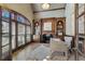 Elegant office with wood-paneled walls, custom built-ins, a cozy fireplace, and an abundance of natural light at 2821 Grey Moss Pass, Duluth, GA 30097