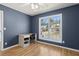 Bedroom with desk, ceiling fan, and a view of the neighborhood at 2882 Manor Glen Ln, Suwanee, GA 30024