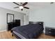 Bedroom with wood floors, a dresser, and natural light at 2882 Manor Glen Ln, Suwanee, GA 30024