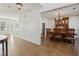 Open-concept dining room featuring a large wooden table and chairs, adjacent to the kitchen area at 2882 Manor Glen Ln, Suwanee, GA 30024