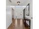 Bright foyer with natural light, tile flooring, and a console table against a neutral-toned wall at 2882 Manor Glen Ln, Suwanee, GA 30024
