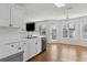 Bright kitchen with white cabinets, stainless steel appliances, and tile flooring at 2882 Manor Glen Ln, Suwanee, GA 30024