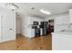 Modern kitchen with white cabinets, black appliances, and neutral tile flooring at 2882 Manor Glen Ln, Suwanee, GA 30024