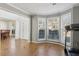 Bright living room featuring large windows, neutral paint, and tile flooring at 2882 Manor Glen Ln, Suwanee, GA 30024