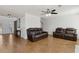 Spacious living room with tile floors, comfortable seating, and a view of the staircase at 2882 Manor Glen Ln, Suwanee, GA 30024