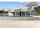 Beautiful water feature with a modern waterfall and elevated dining area at 2882 Manor Glen Ln, Suwanee, GA 30024
