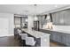 Kitchen featuring granite countertops, gray cabinets, stainless steel appliances, and pendant lighting over the island at 3143 Stonegate Sw Dr, Atlanta, GA 30331