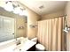 Cozy bathroom with modern fixtures, single vanity, shower and tub with neutral colors at 4125 Madison Bridge Dr, Suwanee, GA 30024