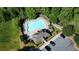 Aerial view of the community pool area with lounge chairs and ample parking at 4125 Madison Bridge Dr, Suwanee, GA 30024