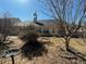 The backyard with a chimney and lots of grass at 50 Cold Springs Ct, Covington, GA 30016