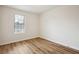 The bedroom features vinyl floors and a window offering ample natural light to the living space at 5151 Martins Crossing Rd, Stone Mountain, GA 30088