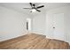 This bedroom features vinyl floors, a ceiling fan and white walls, creating a bright and airy atmosphere at 5151 Martins Crossing Rd, Stone Mountain, GA 30088