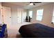 Bright bedroom featuring a ceiling fan, and large windows at 221 Begonia Way, Mcdonough, GA 30253