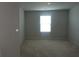 Bright and airy empty room with neutral carpet and good natural light at 221 Begonia Way, Mcdonough, GA 30253