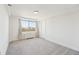 Bedroom featuring neutral carpet and city views from the window at 2479 Peachtree Ne Rd # 1703, Atlanta, GA 30305