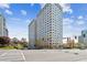 Exterior view of modern condominium complex with manicured landscaping and surrounding city views at 2479 Peachtree Ne Rd # 1703, Atlanta, GA 30305