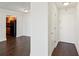 Inviting hallway with sleek, dark hardwood floors leading to a cozy kitchen area at 2479 Peachtree Ne Rd # 1703, Atlanta, GA 30305