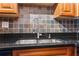 Close up of a kitchen sink with grey tiled backsplash at 2479 Peachtree Ne Rd # 1703, Atlanta, GA 30305